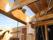 New beam above kitchen nook will allow for more valuable ceiling height (one piece of old beam visible)