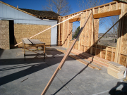 Garage walls are braced before roof trusses are installed