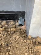 Corrugated steel over sewer pipe outlet