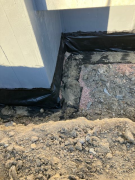 Drain and cover at front entry
