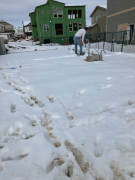 Paul shoveling snow off garage floor