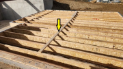 Floor joists are braced before sheathing to keep them perfectly straight