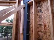 Bolts in Steel Column Holding Timber Beam on Outside  