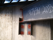 Steel Beams are Bolted to Foundation Walls
