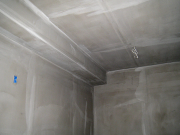Stucco system base in swim storage room
