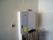 Boiler in garage will also heat walks & driveway apron