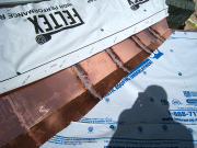 Curved roof valley is soldered with small pieces