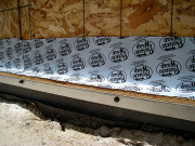 Galvanized steel angle for battered walls at grade condition