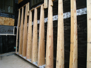 Battered trusses are sheathed with plywood