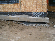 Curb for battered walls by kitchen