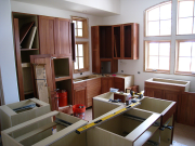 Kitchen cabinets being installed