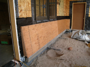 Sheathed battered walls