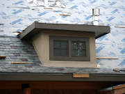 Stucco at dormers is complete