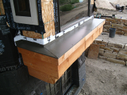 Living room shelf finished with metal flashing