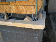 Stone sill between stucco and stone