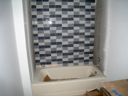 Basement bathroom tile installation in progress