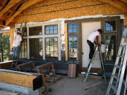 Painters are working on window trim