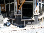 Stone sill being installed