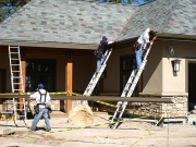 Crew working on garage gutter