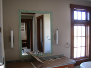 Mirror installed and trimmed with glass tile
