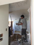 Applying skim coat where popcorn ceiling was removed