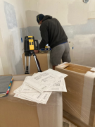 Paul installing kitchen cabinets