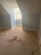 New baseboard installed in bedroom