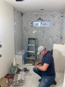 Master bath shower tile installation in progress