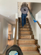 Carpet pad being carried to upper level