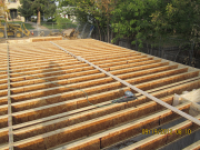 We brace joists straight before plywood install