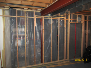 Framed wall with plastic protection barrier in place
