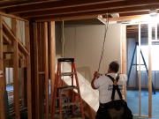 Old stair wall is removed to open up view to basement