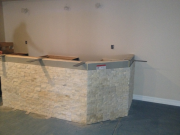 Installing stone of face of bar