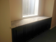 Granite countertop on new cabinets in TV room
