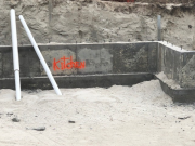 Foundation wall marked for underground plumbing