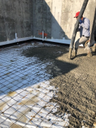 Placing concrete for basement floor