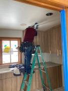 Electrician installing new light