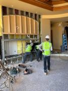 Crew removing old fireplace and vent