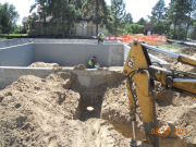 Notched sewer knockout for future sleeve through garage