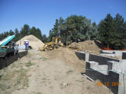 Backhoe working on water to meter pit