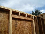 LVL headers are installed flush to outside to allow for rigid insulation