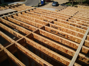 Roll blocks installed over bearing walls and beams