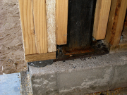 Detail of garage door trimmer and plate set in epoxy