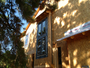 Windows and small roof by stairs.