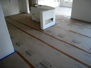 Completed hardwood floors protected with Ram Board