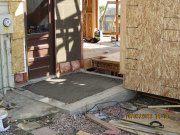 concrete is poured in mudroom below joists