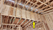 Attic knee walls between high and low ceilings