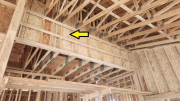 Attic knee wall extended to 5-inch depth to receive insulation 