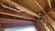 Plumbing drain lines in studio ceiling