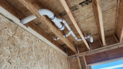 Plumbing drain lines in garage ceiling